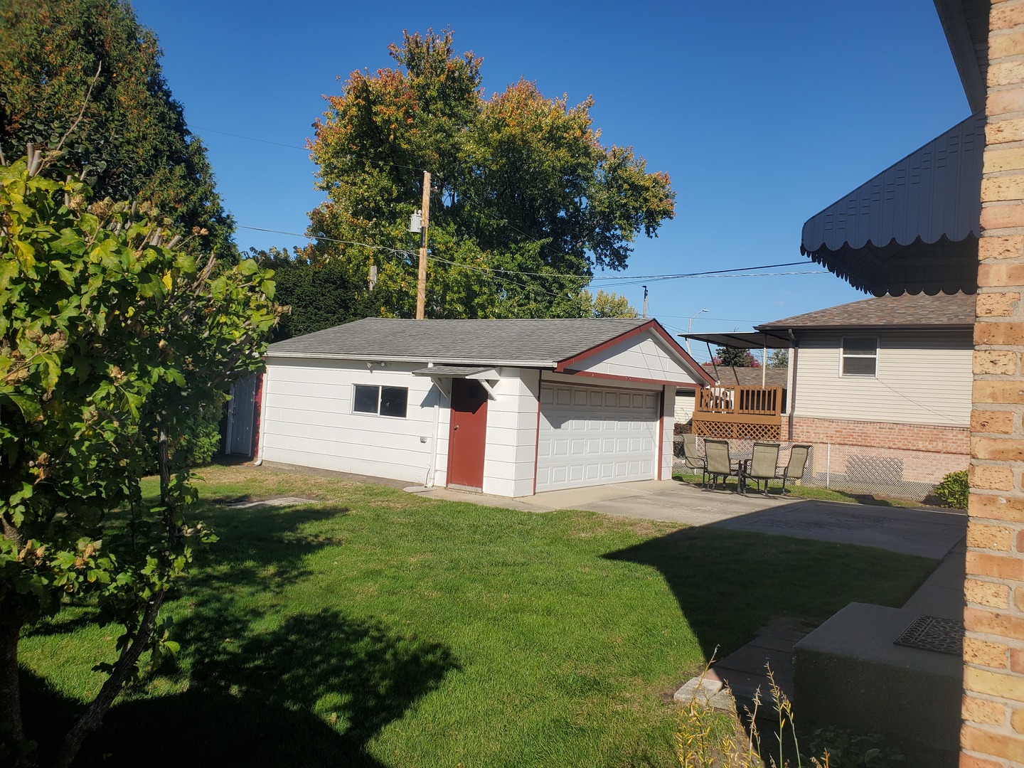 10912 Princess Avenue Chicago Ridge, IL 60415 - Photo 3 of 17 a front view of a house with a yard and garage