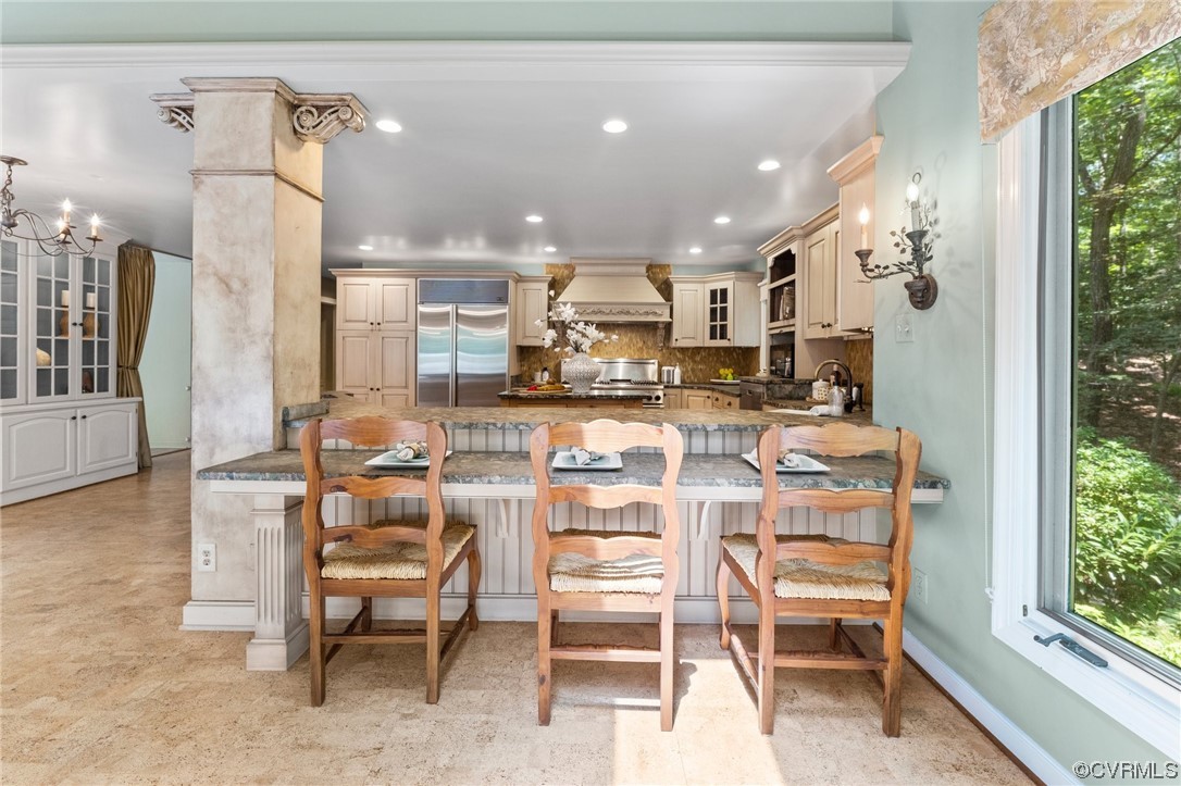 3820 Dunleith Terrace Midlothian, VA 23113 - Photo 13 of 48 a kitchen with a dining table chairs and large windows