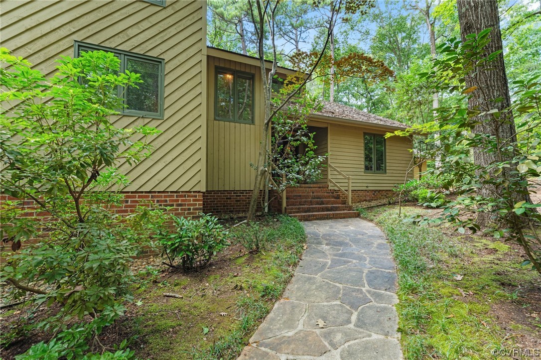3820 Dunleith Terrace Midlothian, VA 23113 - Photo 2 of 48 a backyard of a house with plants and large tree