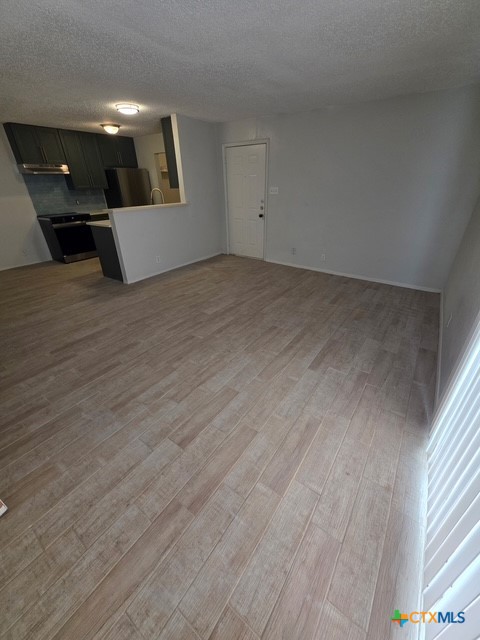 2010 South 15th Street, Unit B Temple, TX 76504 - Photo 5 of 12 a very nice looking room with wooden floor