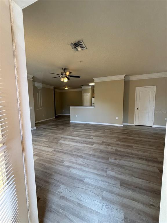 8848 Villa View Circle, Unit 206 Orlando, FL 32821 - Photo 12 of 20 a view of a livingroom with wooden floor