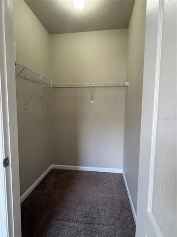 a view of storage and utility room with wooden floor
