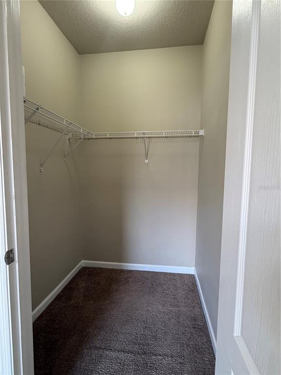 8848 Villa View Circle, Unit 206 Orlando, FL 32821 - Photo 14 of 20 a view of storage and utility room with wooden floor