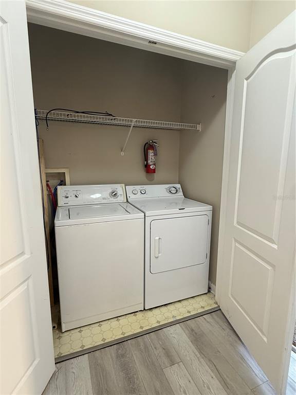 8848 Villa View Circle, Unit 206 Orlando, FL 32821 - Photo 16 of 20 a utility room with dryer and washer