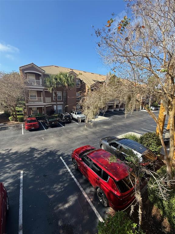 8848 Villa View Circle, Unit 206 Orlando, FL 32821 - Photo 17 of 20 a car parked on the side of the road