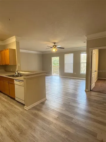 a view of a kitchen with wooden floor