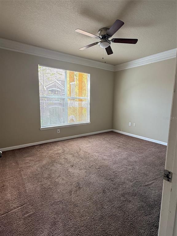 8848 Villa View Circle, Unit 206 Orlando, FL 32821 - Photo 7 of 20 a view of an empty room with a window