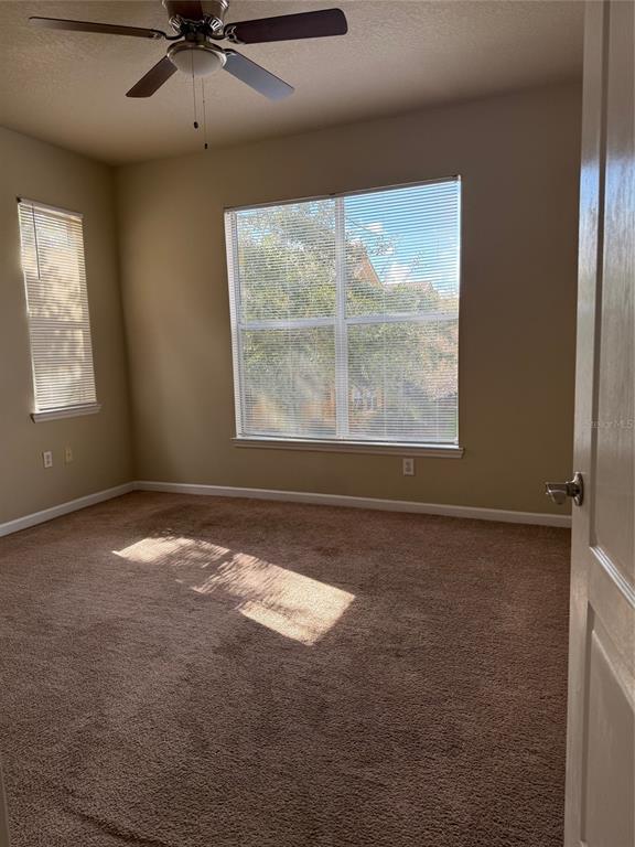 8848 Villa View Circle, Unit 206 Orlando, FL 32821 - Photo 8 of 20 a view of an empty room with a window