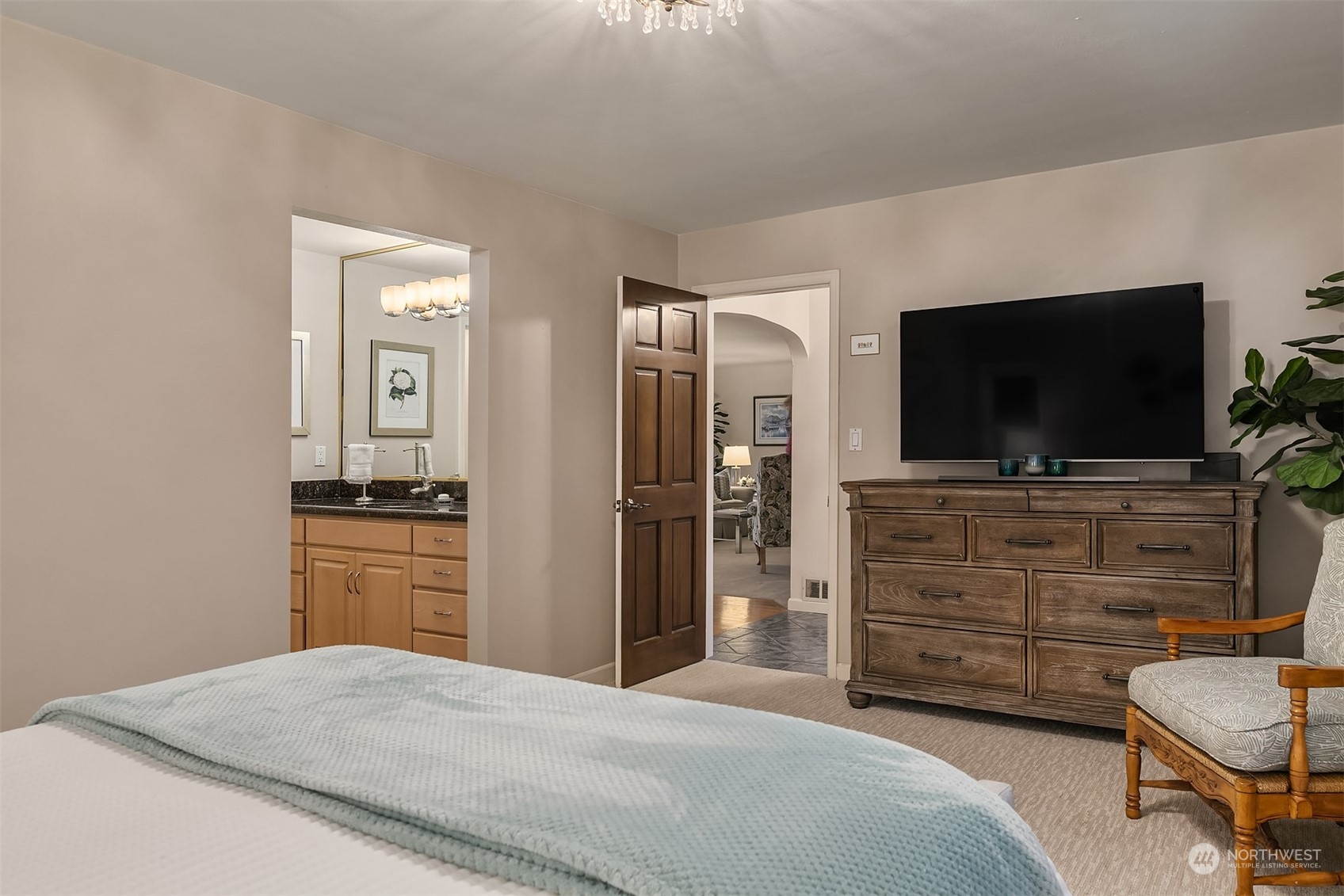 6831 Fisher Road Edmonds, WA 98026 - Photo 26 of 35 a bedroom with a bed and a flat screen tv