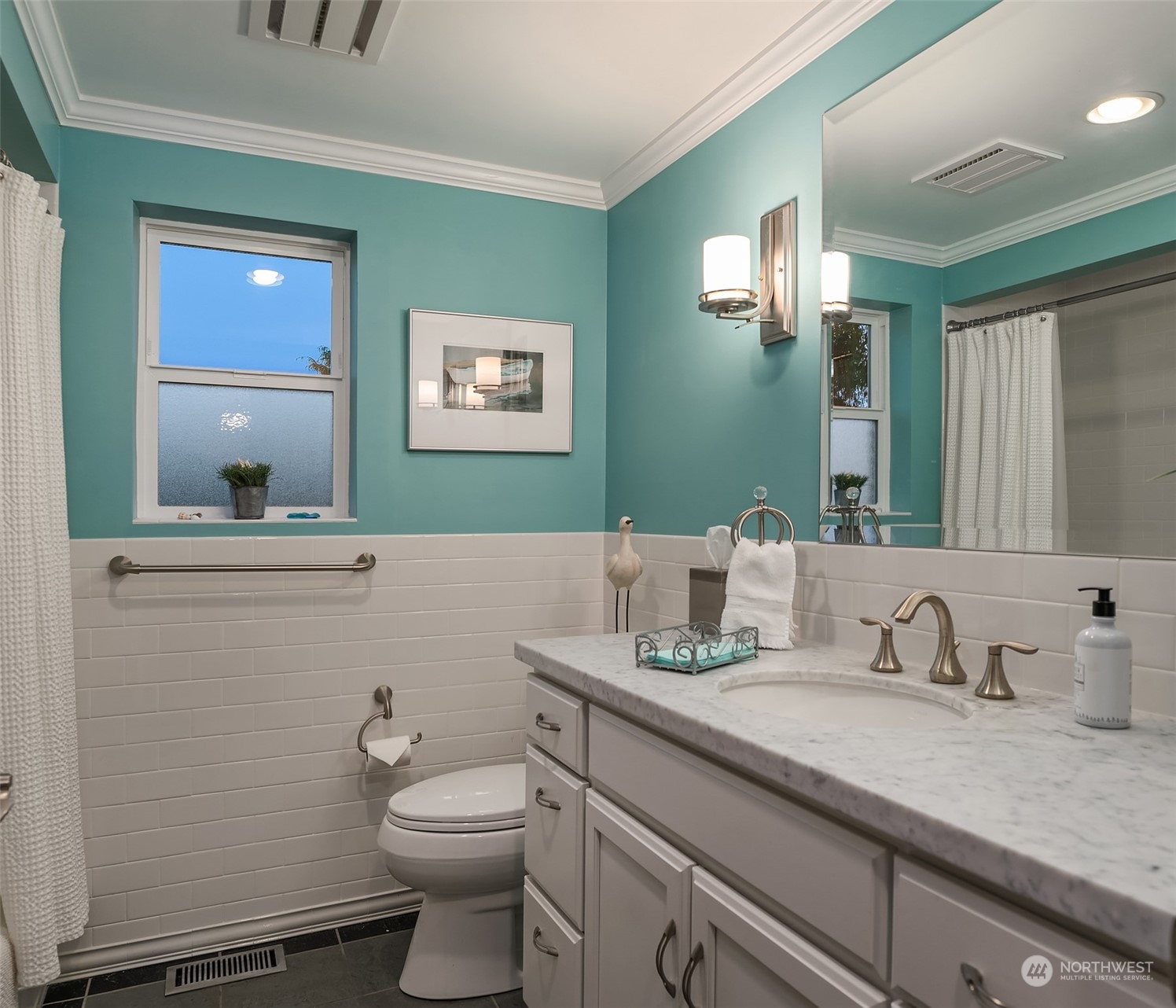6831 Fisher Road Edmonds, WA 98026 - Photo 27 of 35 a bathroom with a granite countertop toilet sink and mirror