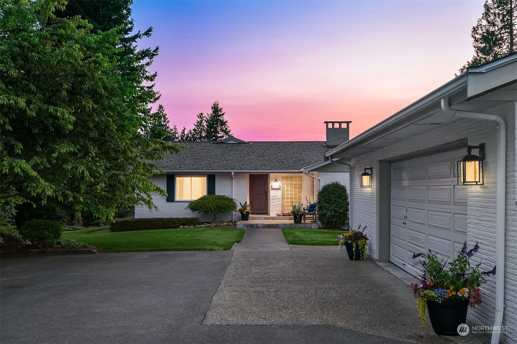 6831 Fisher Road Edmonds, WA 98026 - Photo 3 of 35 a front view of a house with a yard and a garage