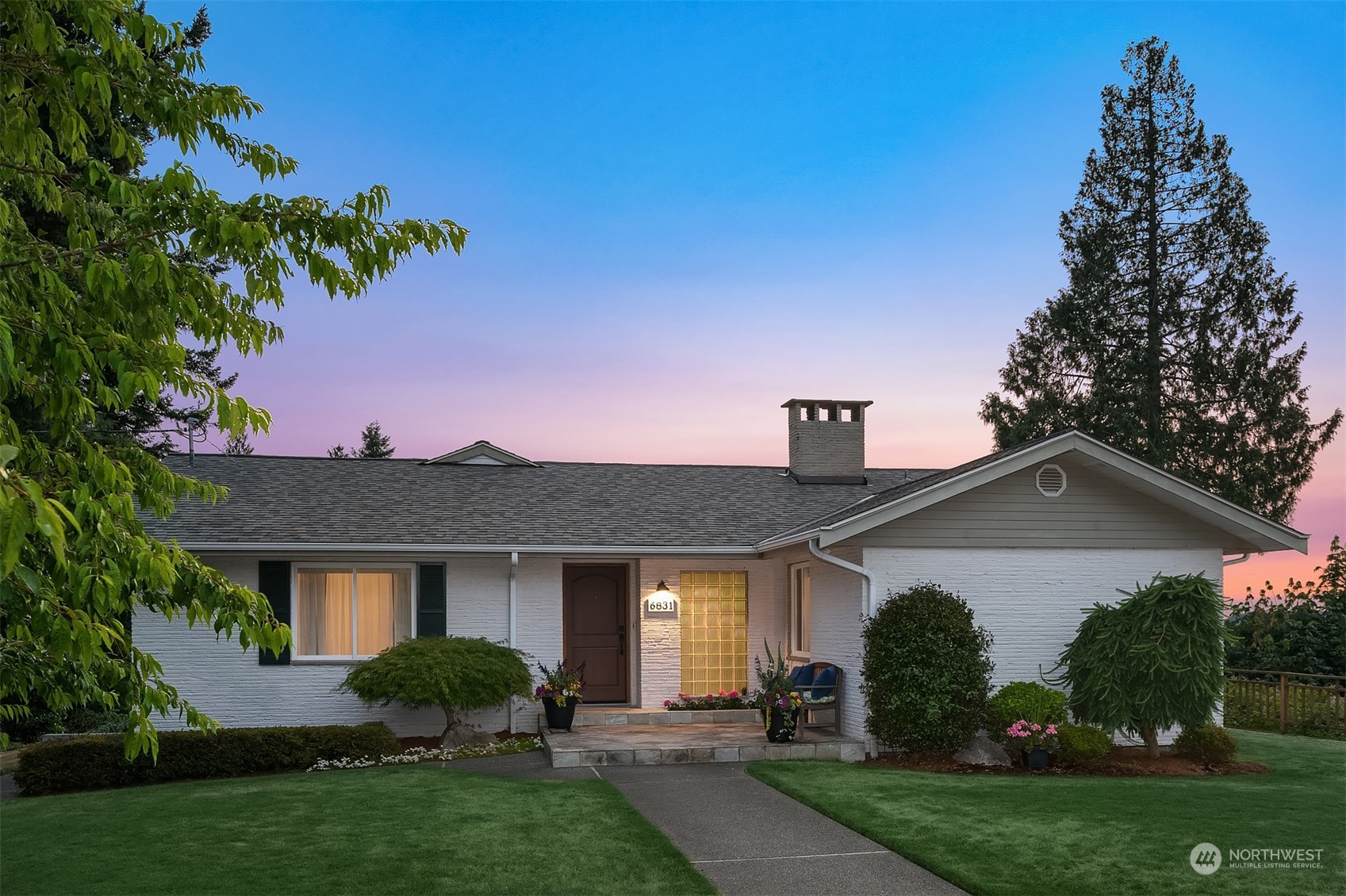 6831 Fisher Road Edmonds, WA 98026 - Photo 4 of 35 a front view of a house with a yard and garage