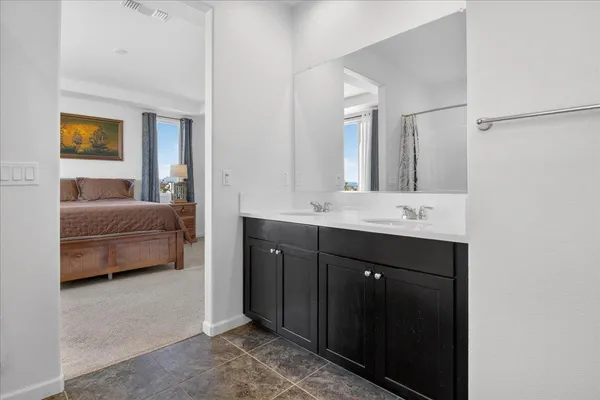 a white bath tub sitting next to a white wall