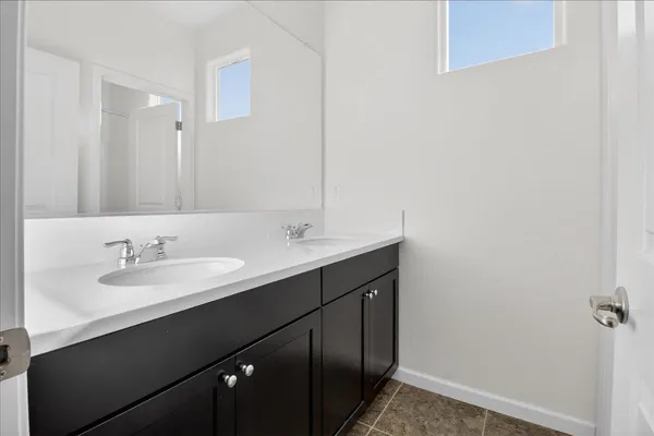 a bathroom with a toilet and a bathtub