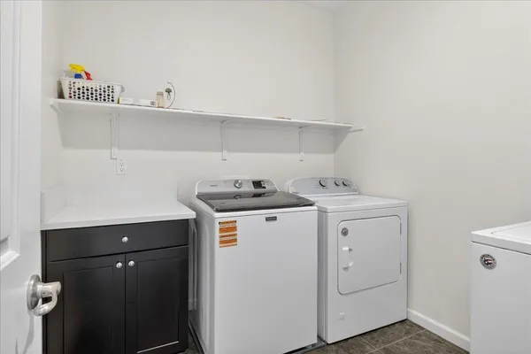 a building outdoor space with patio furniture and potted plants