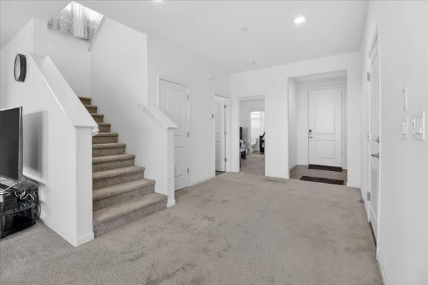 a bathroom with a sink toilet and window