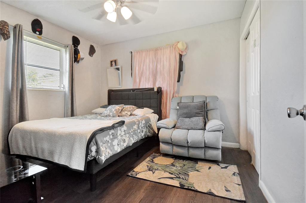 6533 Southwest 22nd Street Miramar, FL 33023 - Photo 14 of 16 a bedroom with a bed and a couch