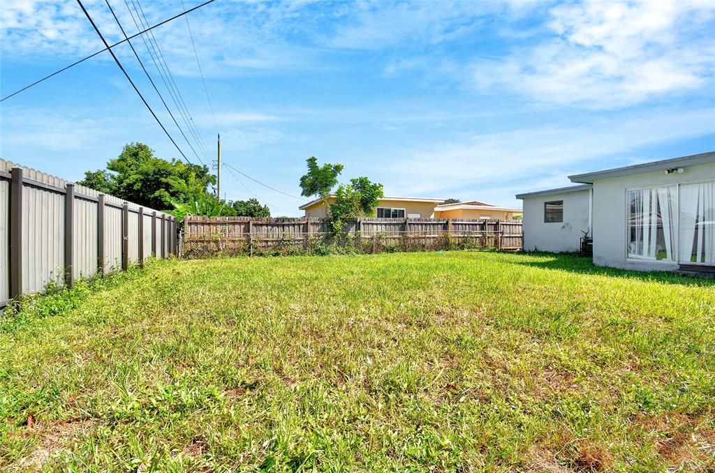 6533 Southwest 22nd Street Miramar, FL 33023 - Photo 16 of 16 a view of a house with backyard and sitting area