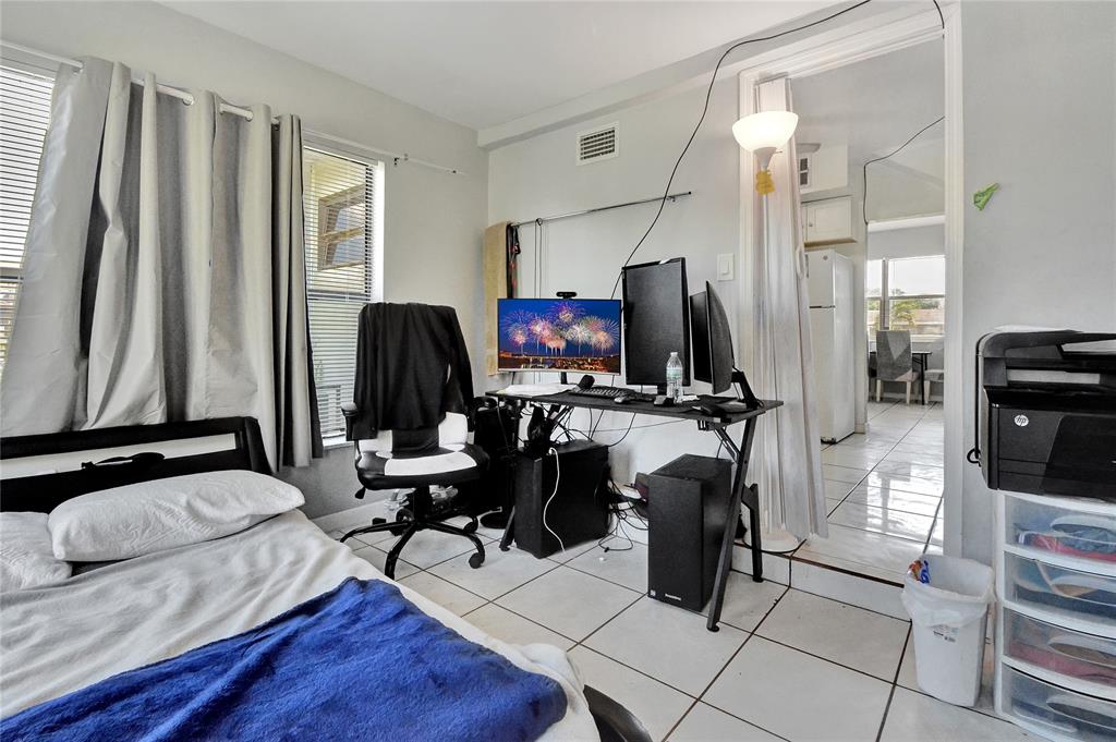 6533 Southwest 22nd Street Miramar, FL 33023 - Photo 5 of 16 a living room with furniture and a flat screen tv