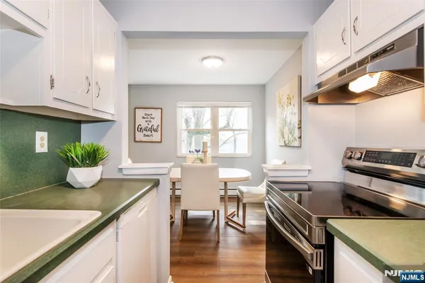 a kitchen with a table and chairs