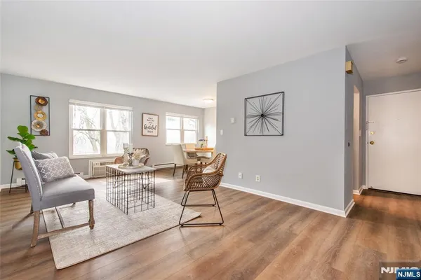 a view of a livingroom with furniture and wooden floor