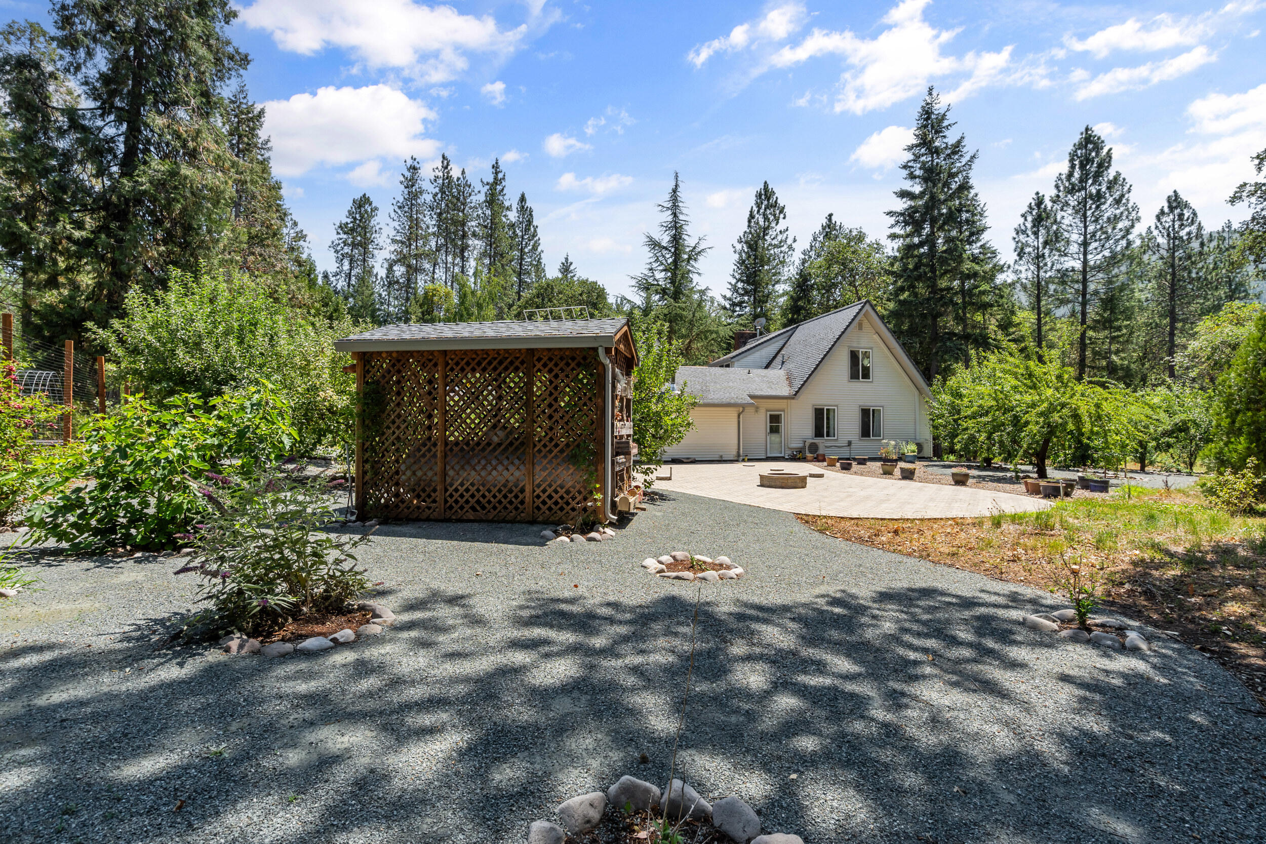 3806 Jumpoff Joe Creek Road Grants Pass, OR 97526 - Photo 51 of 78 a view of house with outdoor space and sitting area