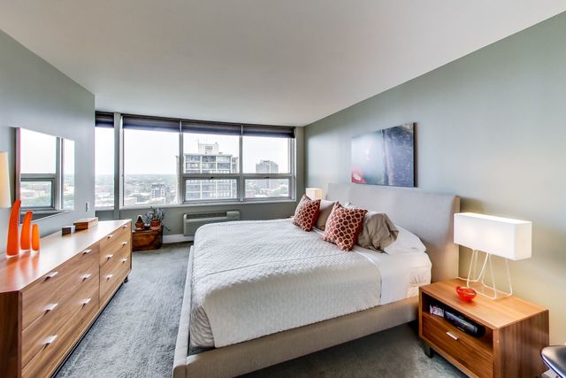 5733 North Sheridan Road, Unit 16B Chicago, IL 60660 - Photo 15 of 27 a bedroom with a bed and large windows