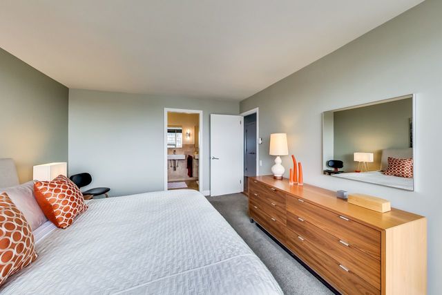 5733 North Sheridan Road, Unit 16B Chicago, IL 60660 - Photo 16 of 27 a bedroom with a bed and a large mirror