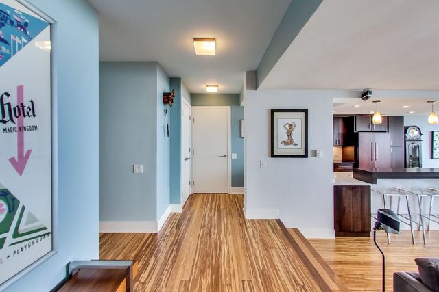 5733 North Sheridan Road, Unit 16B Chicago, IL 60660 - Photo 5 of 27 a view of a hallway with workspace and wooden floor