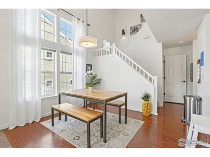 a view of entryway livingroom and hall with wooden floor
