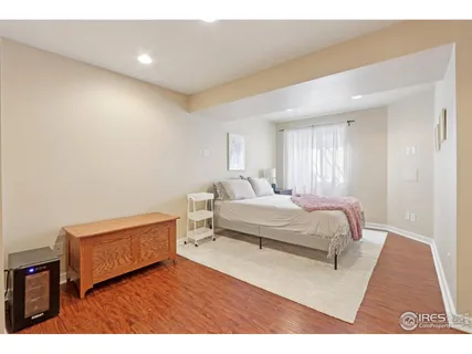 a bedroom with a bed and a night stand