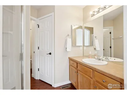 a bathroom with a double vanity sink mirror and