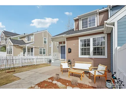 a front view of a house with a bench