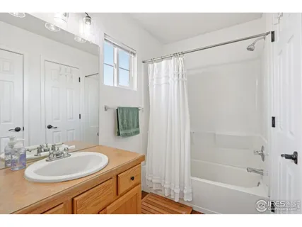 a bathroom with a sink toilet a shower and a mirror