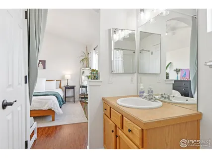 a bathroom with a sink vanity and a mirror
