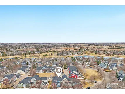 an aerial view of residential building and parking space