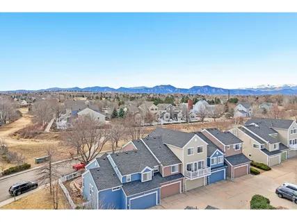 an aerial view of residential houses with outdoor space