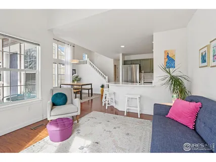 a bedroom with furniture and a potted plant