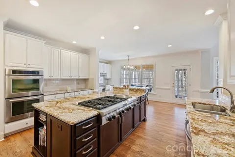 a kitchen with a stove and a sink