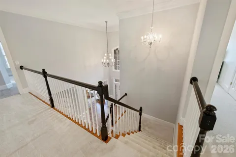 a view of a hallway with staircase