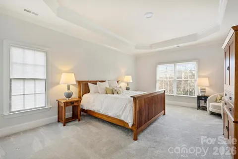 a bed room with a bed and a chair