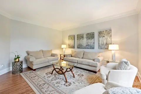 a living room with furniture and a rug