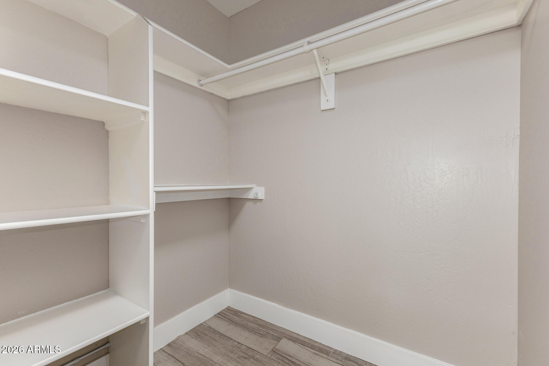 15041 North 6th Street Phoenix, AZ 85022 - Photo 18 of 45 a view of an empty walk in closet