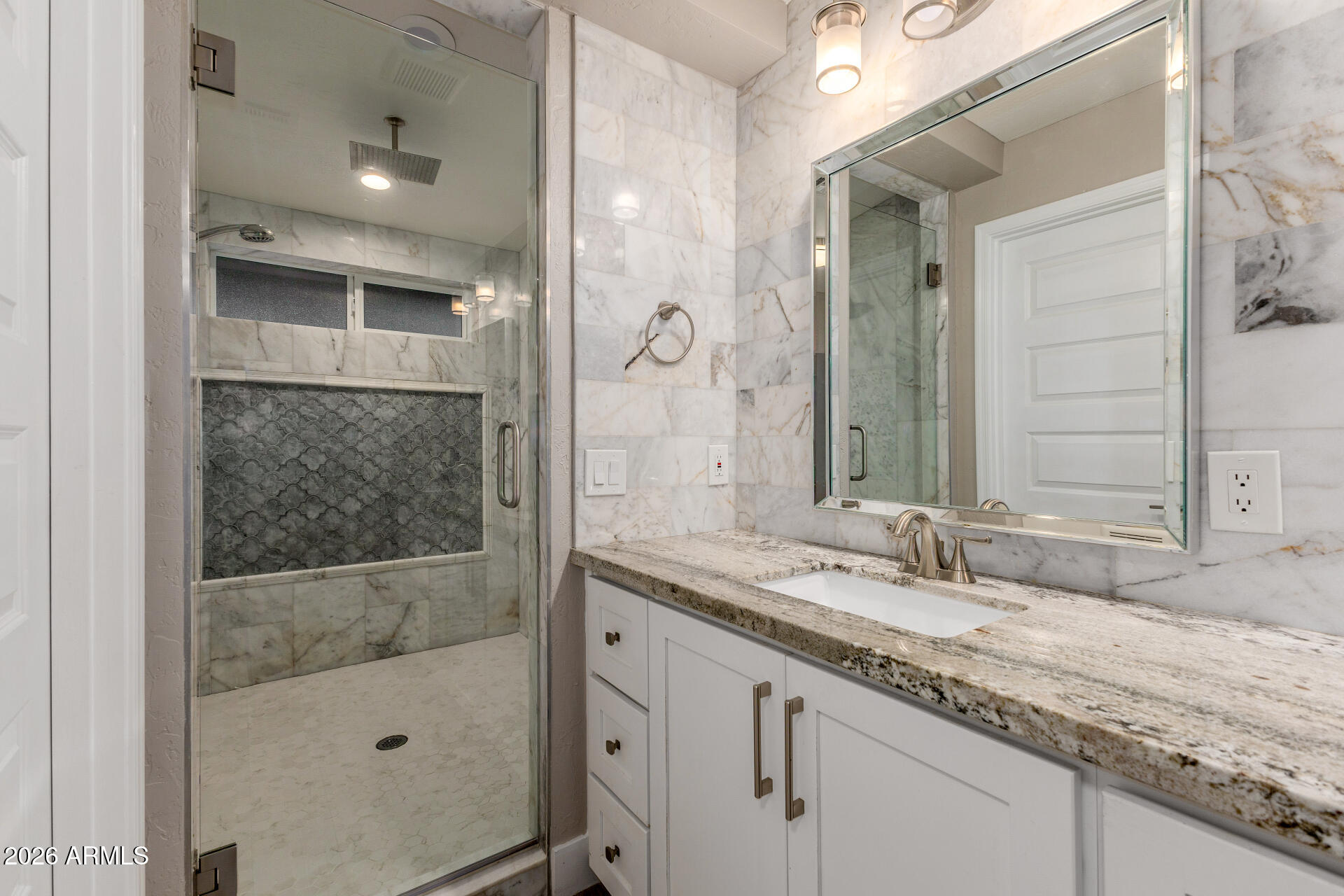 15041 North 6th Street Phoenix, AZ 85022 - Photo 23 of 45 a bathroom with a granite countertop sink a mirror and shower