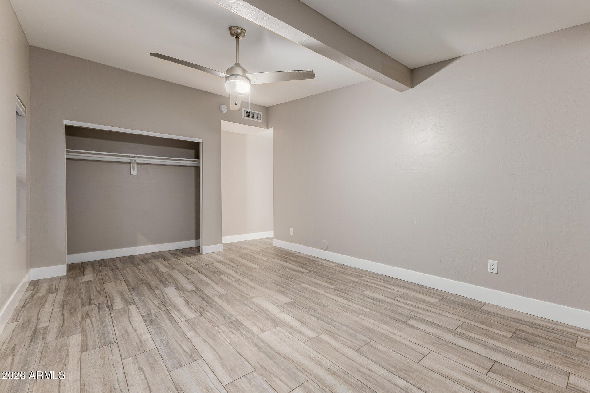 15041 North 6th Street Phoenix, AZ 85022 - Photo 29 of 45 a view of an empty room with wooden floor