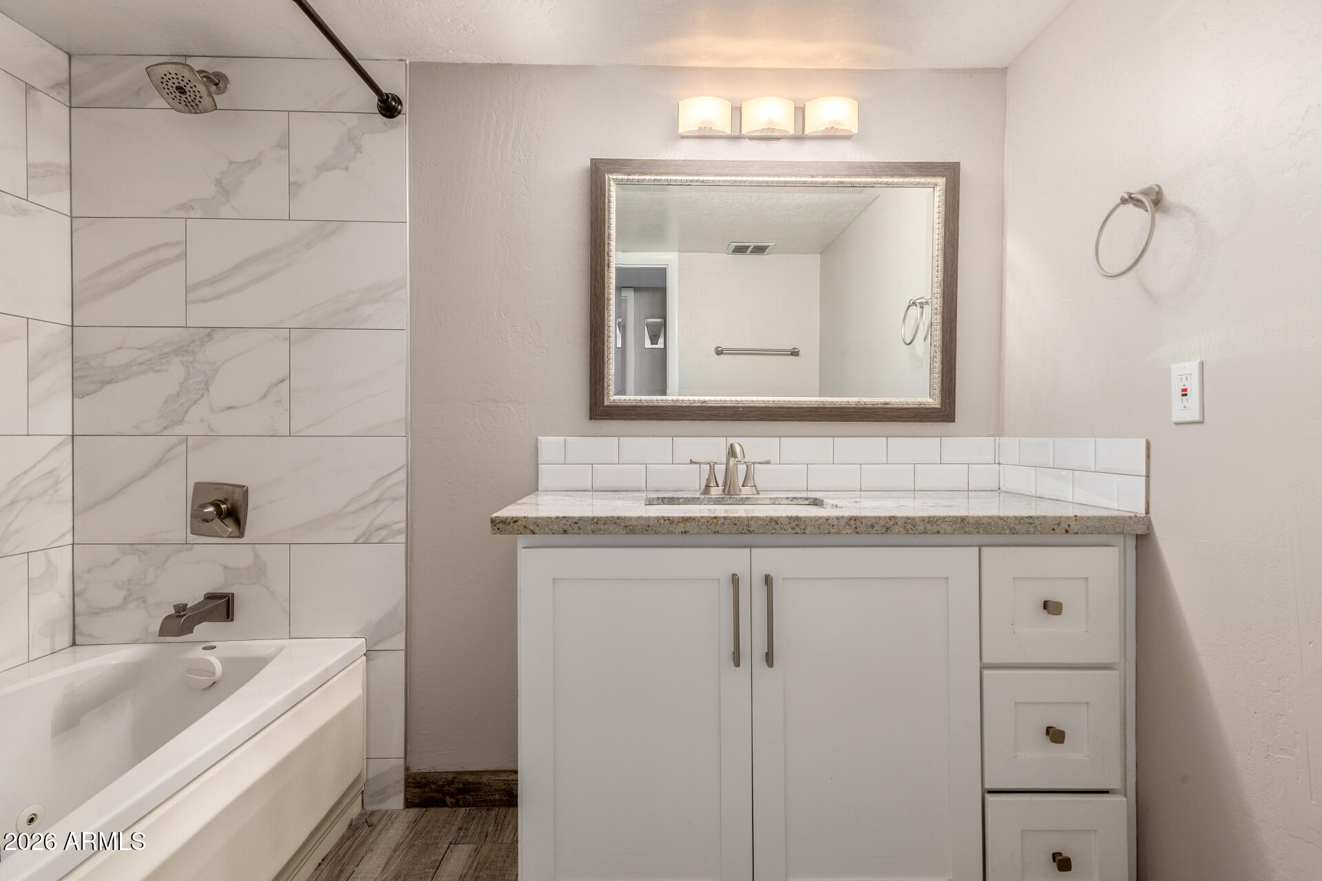 15041 North 6th Street Phoenix, AZ 85022 - Photo 30 of 45 a bathroom with a granite countertop sink mirror and bathtub