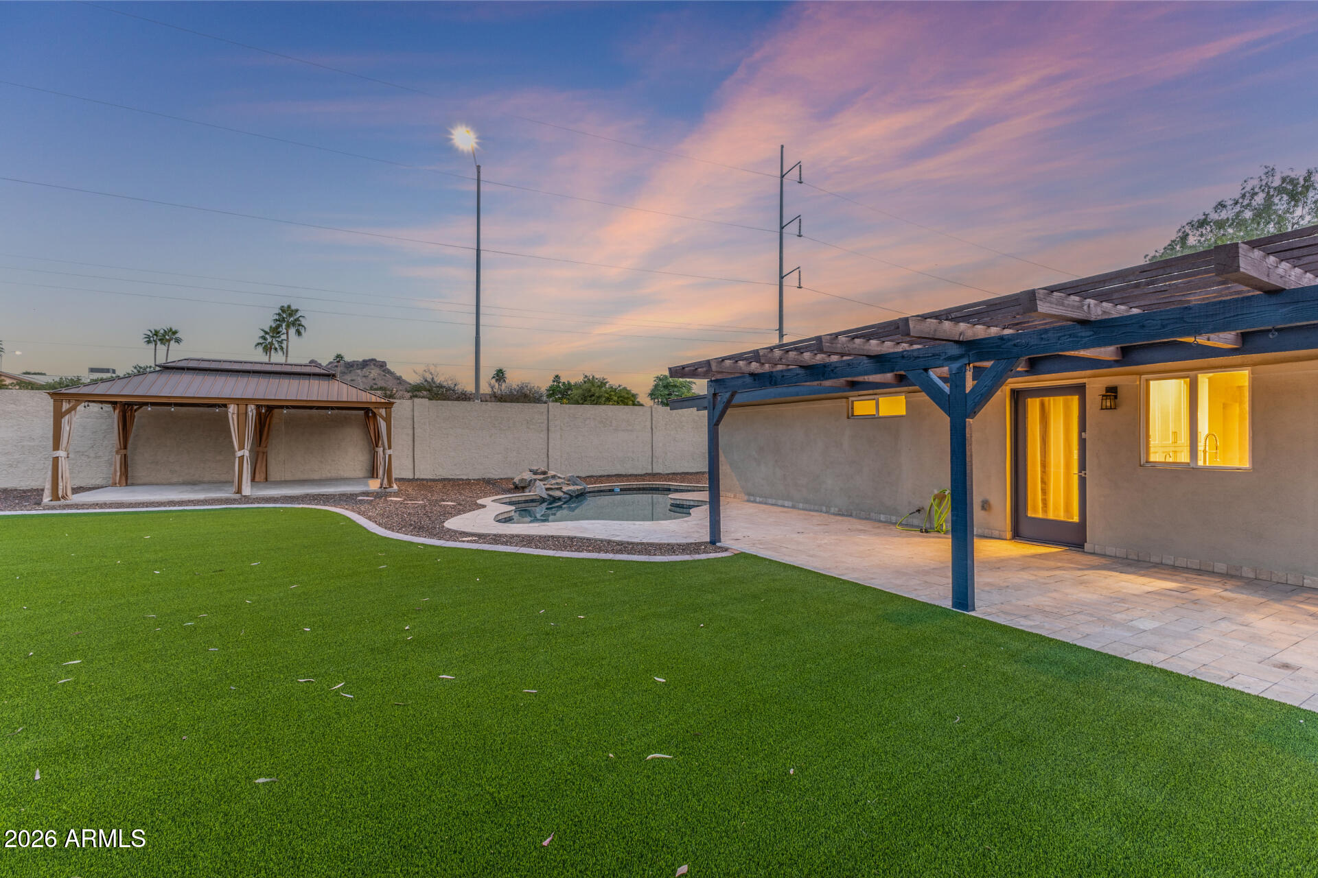 15041 North 6th Street Phoenix, AZ 85022 - Photo 34 of 45 a view of a backyard with a small pool