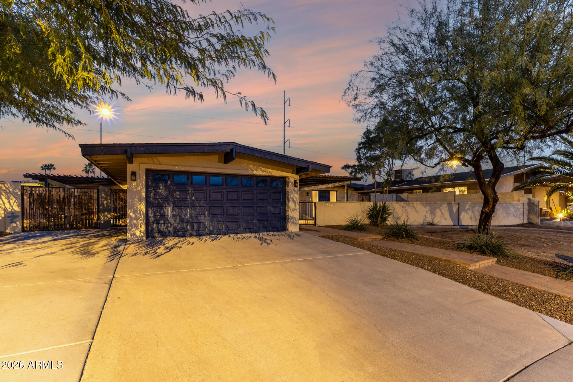 15041 North 6th Street Phoenix, AZ 85022 - Photo 42 of 45 a front view of a house with a yard and garage