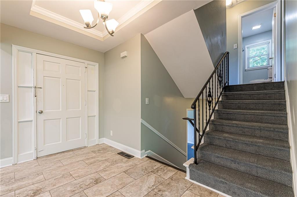 1574 Old Spring House Lane Atlanta, GA 30338 - Photo 13 of 55 a view of entryway with wooden floor and stairs
