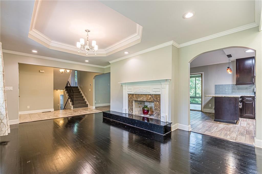 1574 Old Spring House Lane Atlanta, GA 30338 - Photo 14 of 55 a living room with furniture and a fireplace